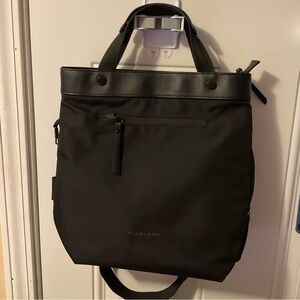 Sherpani Geo black crossbody with top handles.